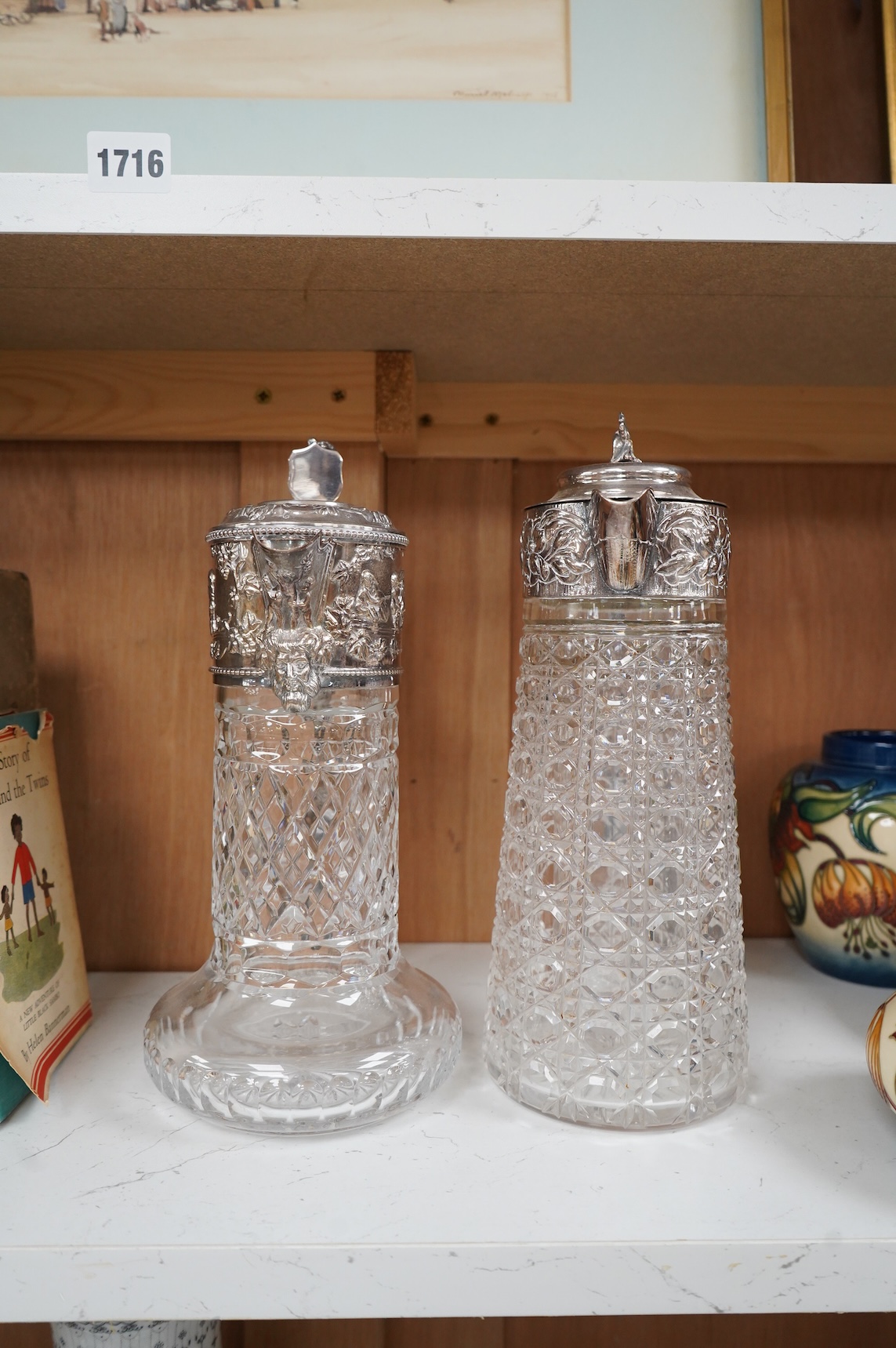 A silver plate mounted glass lemonade jug and a similar claret jug, largest 29cm high